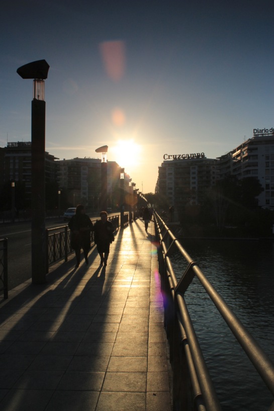 Late afternoon silhouettes on the Puente de San Telmo, one of multiple bridges that now cross the Guadalquivir.